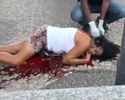 Woman murdered while drinking beer on the street